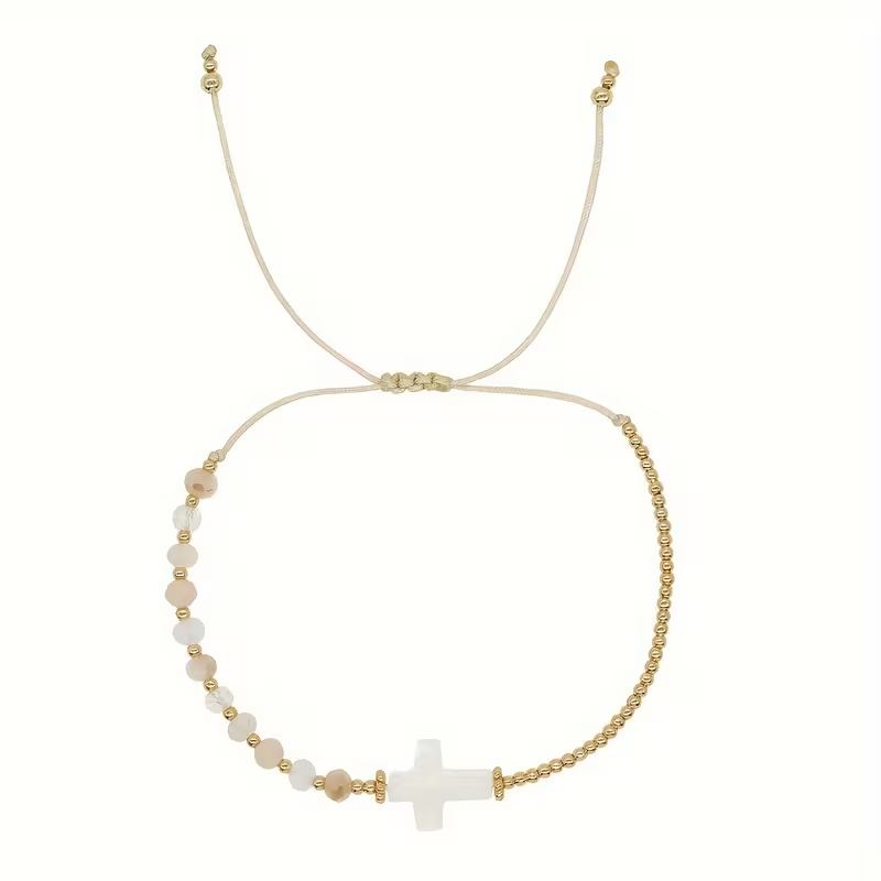 Cross bead bracelet with natural stone beads and gold-tone accents on adjustable cord